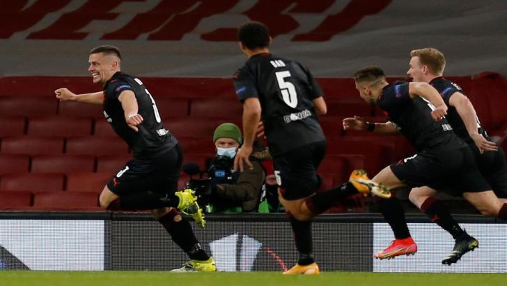 Slavia Prague players celebrate an equaliser at Arsenal